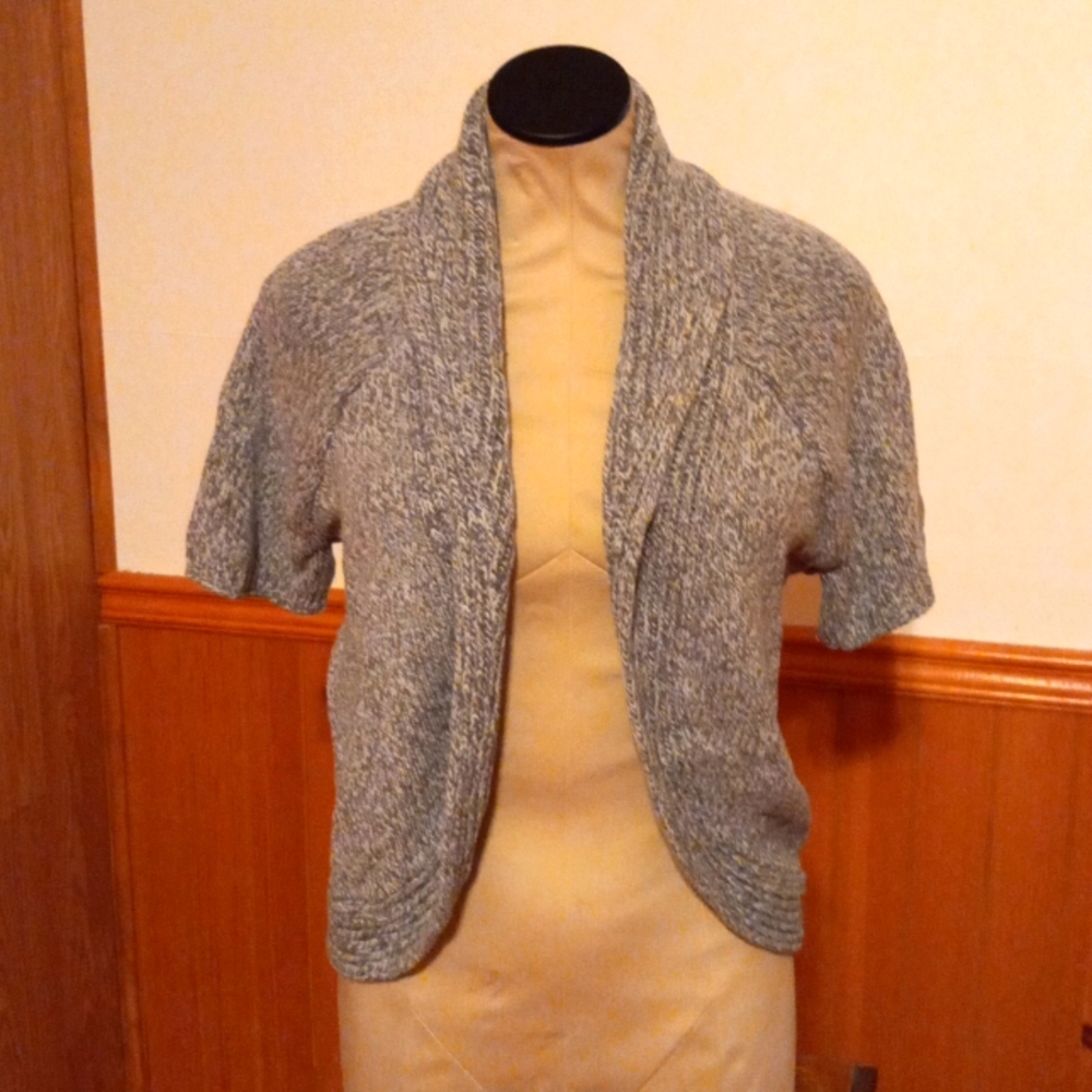 Short sleeve button free shrug sweater. Very cute!